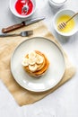 cooked pancake on plate top view at wooden background