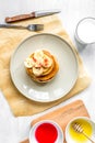 cooked pancake on plate top view at wooden background