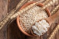 Cooked peeled barley grains in wooden bowl Royalty Free Stock Photo