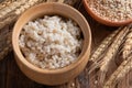 Cooked peeled barley grains in wooden bowl Royalty Free Stock Photo