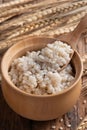 Cooked peeled barley grains in wooden bowl Royalty Free Stock Photo