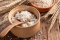 Cooked peeled barley grains in wooden bowl Royalty Free Stock Photo