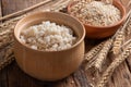 Cooked peeled barley grains in wooden bowl Royalty Free Stock Photo