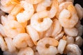 Cooked peeled prawns, shrimps, in frying cast iron pan or pot, top view flat lay