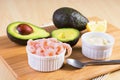 Cooked peeled shrimps with avocado and white sauce