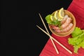 Shrimp on a wooden plate with wooden chopsticks Royalty Free Stock Photo