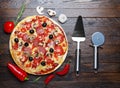 Cooked pizza with lifter and cutter Royalty Free Stock Photo