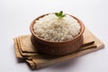 Cooked plain white basmati rice in terracotta bowl, selective focus