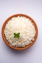 Cooked plain white basmati rice in terracotta bowl, selective focus