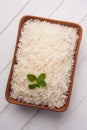 Cooked plain white basmati rice in terracotta bowl, selective focus