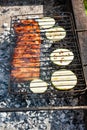 Cooked pork ribs with sliced squash in grill Royalty Free Stock Photo