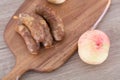 Cooked pork sausage and washed peaches Royalty Free Stock Photo