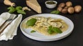 Cooked ravioli or tortelli with cheese, basil, and mushrooms