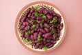 Cooked red beans plate on pink background, isolated. Healthy food Royalty Free Stock Photo