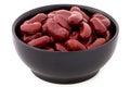 Cooked red kidney beans in a black ceramic bowl isolated on white Royalty Free Stock Photo