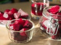 Cooked red slices beetroot in plate and glass bowls. Glass of beetroot juice