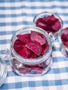 Cooked red slices beetroot in plate and glass bowls