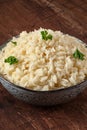 Cooked rice in a bowl, close-up on a wooden table Royalty Free Stock Photo