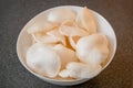 Cooked rice chips in bowl - Grey background