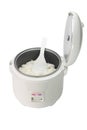 Cooked rice in electric cooker with plastic spoon