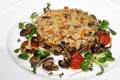 Cooked rice with mushrooms decorated with cherry tomatoes Royalty Free Stock Photo