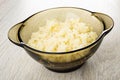 Cooked rice porridge in brown bowl on light wooden table Royalty Free Stock Photo