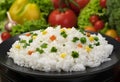 Cooked rice porridge, served with herbs and vegetables