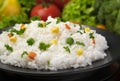 Cooked rice porridge, served with herbs and vegetables