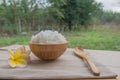 Cooked rice in a wooden bowl and spoon on a wood background. Royalty Free Stock Photo