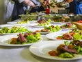 Cooked Roast Beef, Fresh Salad And Tomatoes Served On White Plates. Cooking Master Class, Workshop with People Learning How to