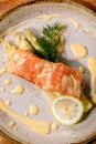 Cooked salmon fish on homemade ceramic plate Royalty Free Stock Photo