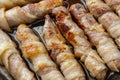 Cooked sausages in bacon. bacon roll close up. Abstract background with bacon Royalty Free Stock Photo