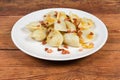 Cooked savory filled dumplings flavored with fried bacon and onion