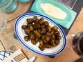 Cooked in shells land snails served on plate with aioli Royalty Free Stock Photo