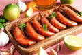 Cooked shrimp and langoustines, king prawns with lime, garlic and parsley. Grilled and fried on pink background Royalty Free Stock Photo