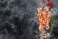 Cooked sizzling hot tasty crispy bacon. Black background. Top view. Copy space Royalty Free Stock Photo
