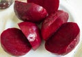 Cooked sliced peeled beetroot vegetable. Nutritional and healthy food. It`s sliced on a plate ready to be eaten or to prepare a di