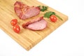 Cooked sliced pork barbecue steak on wooden cutting board on the white background Royalty Free Stock Photo