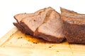 Cooked, sliced roastbeef on a wooden board Royalty Free Stock Photo