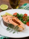 Cooked on steam salmon steak with vegetables