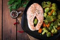 Cooked on steam salmon steak with vegetables. Royalty Free Stock Photo