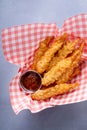 Cooked tempura shrimp in a basket with dipping sauce