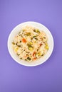 Cooked white rice mixed with colorful vegetables onion, green beans, tomato Royalty Free Stock Photo