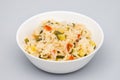 Cooked white rice mixed with colorful vegetables onion, green beans, tomato Royalty Free Stock Photo