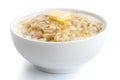 Cooked whole porridge oats with milk and butter in white ceramic