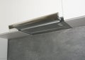 Cooker Hood. Modern air exhauster kitchen fan or range hood. Stainless steel chimney hood. Island hood.