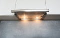 Cooker Hood. Modern air exhauster kitchen fan or range hood. Stainless steel chimney hood. Island hood