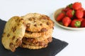 Cookie with chocolate on slate plate and strawberry on light background. dessert concept Royalty Free Stock Photo