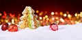 Cookie Tree on Snow with red Christmas Lighs Royalty Free Stock Photo