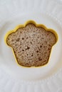 Cookie cutter sandwich on a white plate isolated